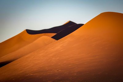 Scenic view of desert against clear sky