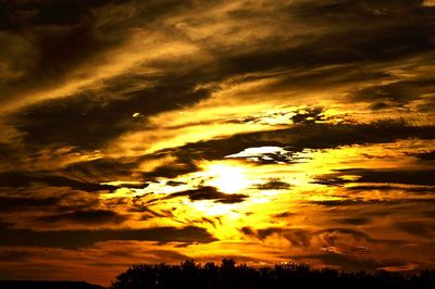 Scenic view of dramatic sky during sunset