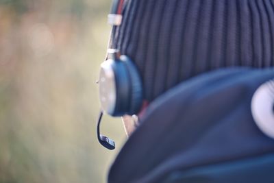 Midsection of man wearing hat
