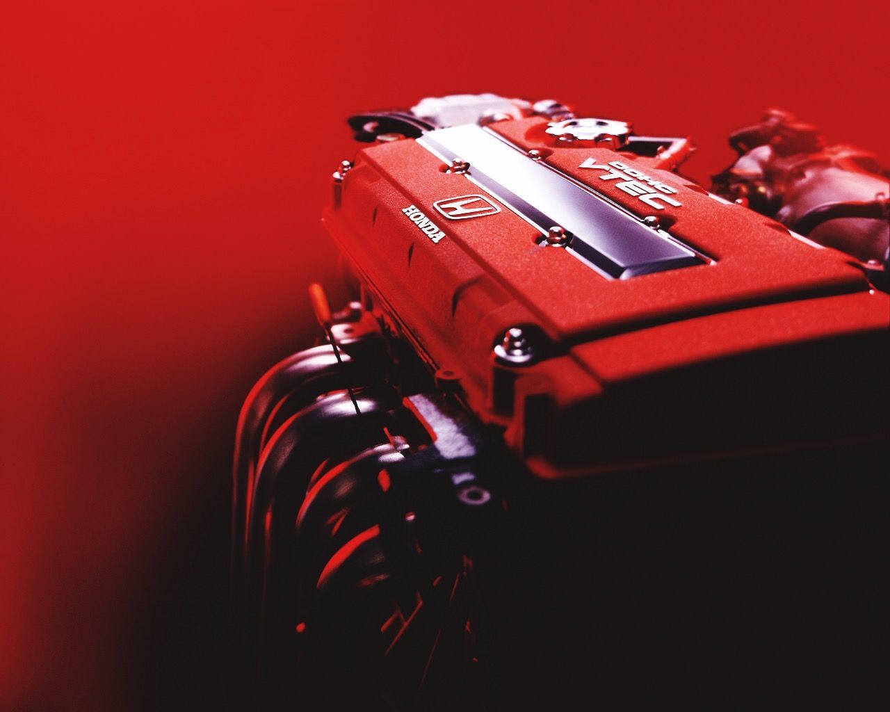 red, transportation, land vehicle, close-up, mode of transport, high angle view, indoors, still life, no people, technology, arts culture and entertainment, stationary, equipment, metal, car, selective focus, single object, part of, old-fashioned