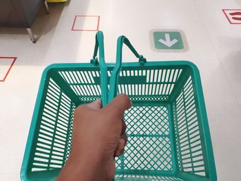 Low section of person holding metal