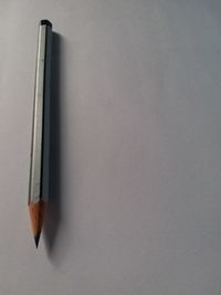 High angle view of pencils on paper