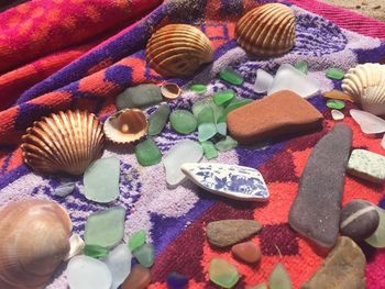 High angle view of multi colored umbrellas on rock