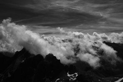 Aerial view of clouds over mountain