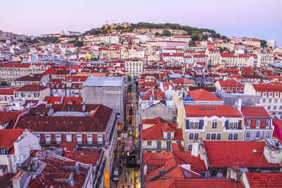 High angle view of buildings in city against clear sky