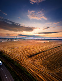 Scenic view of road against sky during sunset