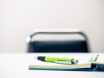 Close-up of pen on table