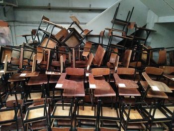 Close-up of chairs on table