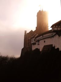 Low angle view of tower at sunset