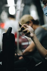 Close-up of man working on stage