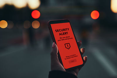 Security alert on smartphone screen. antivirus warning. private data protection system notification