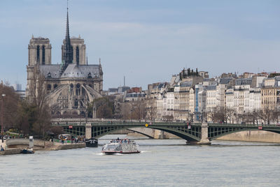 Bridge over river with buildings in background