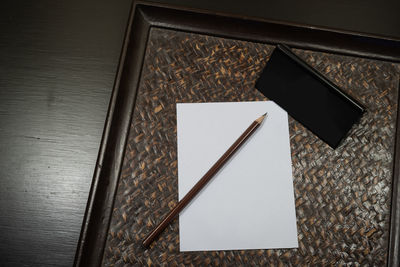 High angle view of paper on table