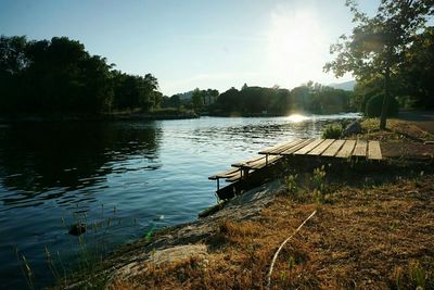 Scenic view of lake at sunset