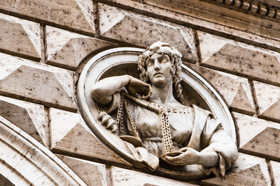 Low angle view of statue on wall