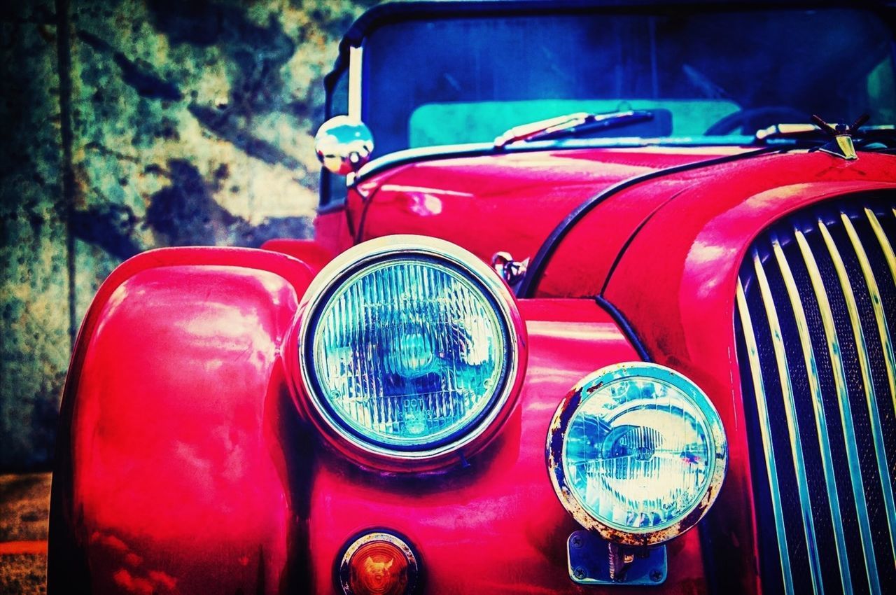 transportation, land vehicle, mode of transport, car, red, headlight, stationary, vintage car, reflection, close-up, side-view mirror, glass - material, street, old-fashioned, part of, travel, vehicle interior, wheel, no people, parking