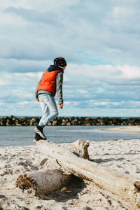 Side view of man standing on beach