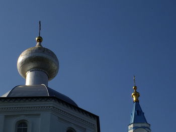 Low angle view of building against blue sky