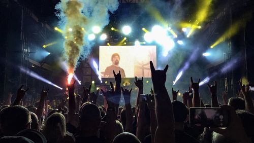 People enjoying music concert