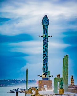 Low angle view of statue against sky