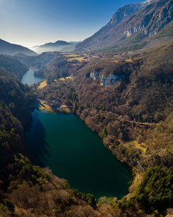 High angle view of lake and mountains against sky