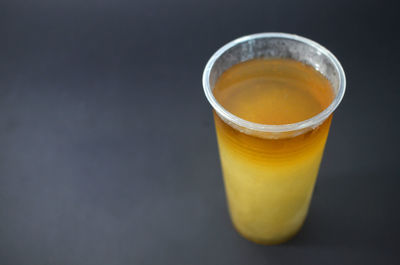 Close-up of tea cup against black background