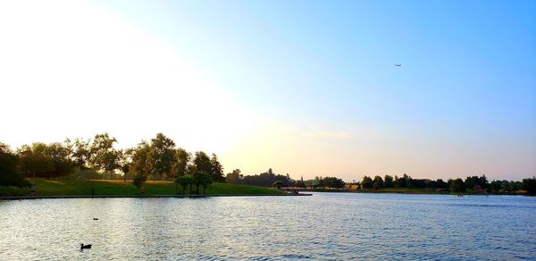 Scenic view of lake against sky during sunset