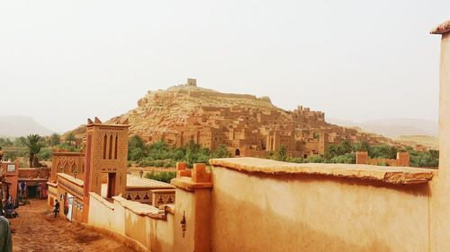 Castle on mountain against clear sky