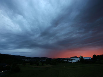 Scenic view of storm clouds over landscape