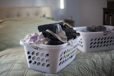 Close-up of wicker basket on bed