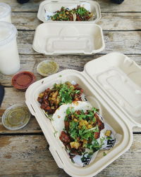 High angle view of fresh food in lunch box on table