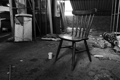 Chairs and table in abandoned room