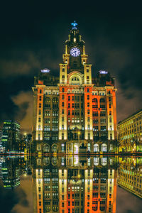 Illuminated buildings in city at night