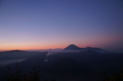 Scenic view of mountains at sunset