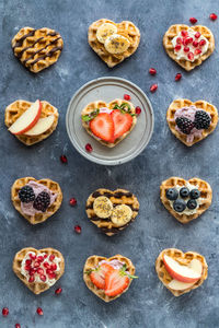 Mini heart shaped waffles with the selective focus on the one on the stand.