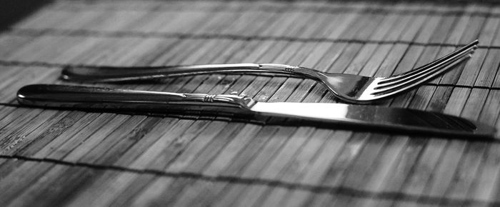 Close-up of fork and table knife on table