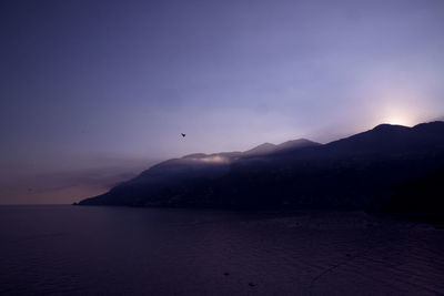 Scenic view of sea against sky at sunset