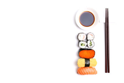 Directly above shot of sushi against white background