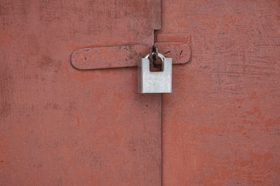 Close-up of padlock on door
