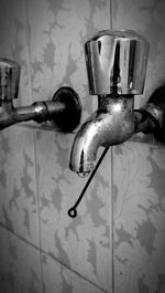 Close-up of faucet in bathroom