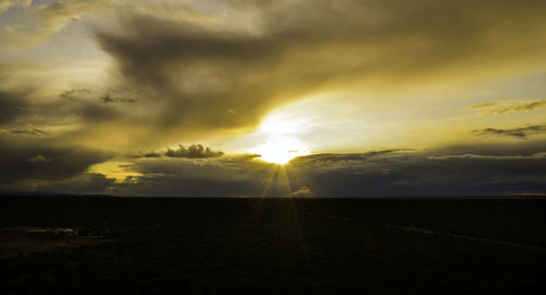 Scenic view of field against sky during sunset