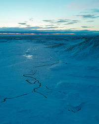 Scenic view of sea against sky during winter