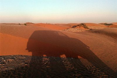 Scenic view of desert against clear sky