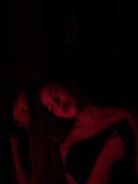 Young woman in darkroom