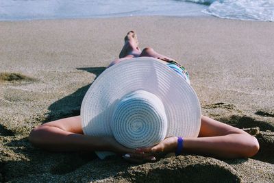 Woman lying on beach