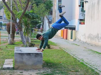 Full length of a man jumping in city