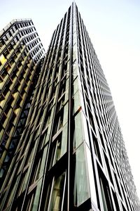 Low angle view of modern buildings against clear sky