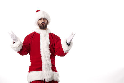 Midsection of man with arms raised against white background