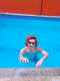 Portrait of young woman in swimming pool