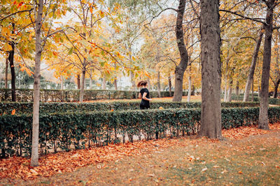 Man standing in park during autumn